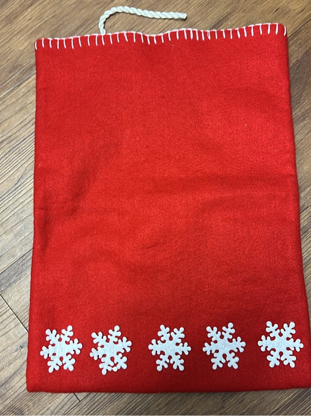 Red Felt Christmas Gift Bag with White Snowflake Accents & Drawstring Closure